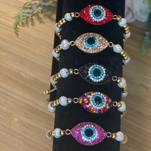 Adjusta bracelets with zirconia eye Perl and gold plated